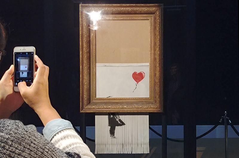 Banksy Girl with Balloon Sotheby's - Photo Ludovic Sanejouand